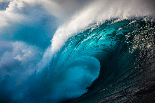 istock Powerful blue open ocean wave barrelling in warm morning light 1398224927