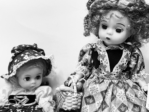 Two dolls black and white image