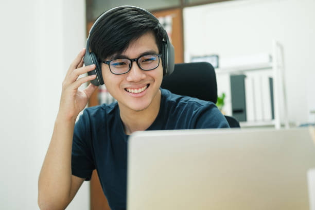 istock Young man study in front of the laptop computer at home 1398227576