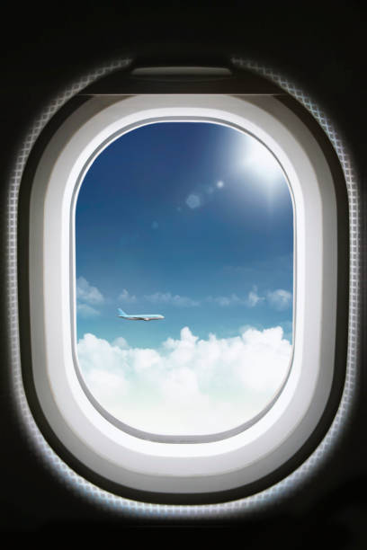 istock View from airplane window during travel and clear blue sky and clouds 1398229092
