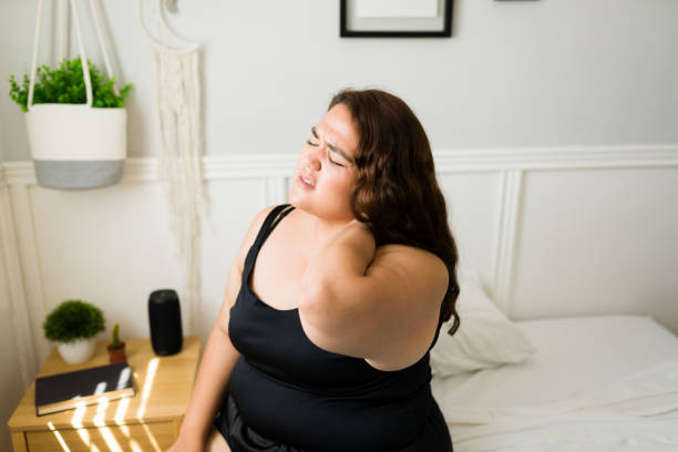 istock Stressed woman with a neck injury 1398230408