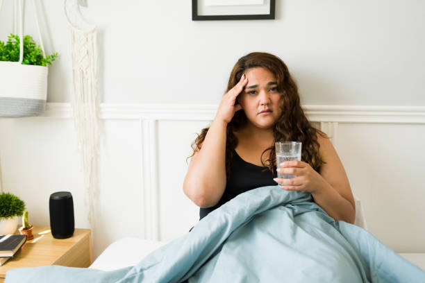 istock Ill overweight woman after a night drinking 1398230583