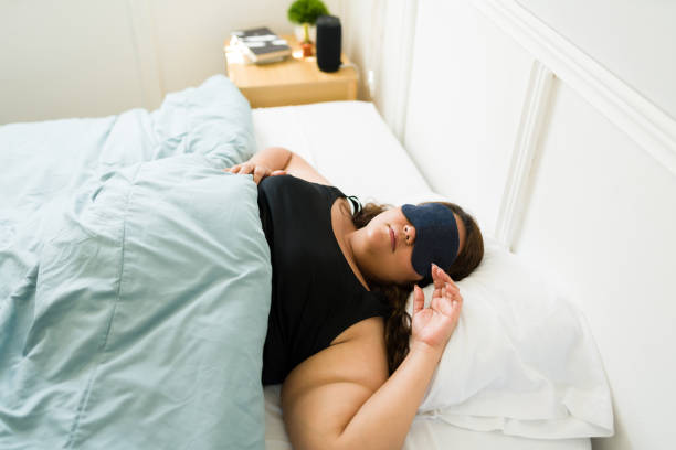 istock Top view of a relaxed fat woman sleeping 1398230604