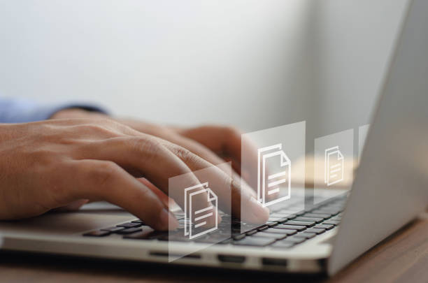 istock Businessman working with document management symbols with icons on screen virtual ERP data digital files or software. record keeping database technology file access document sharing 1398236830