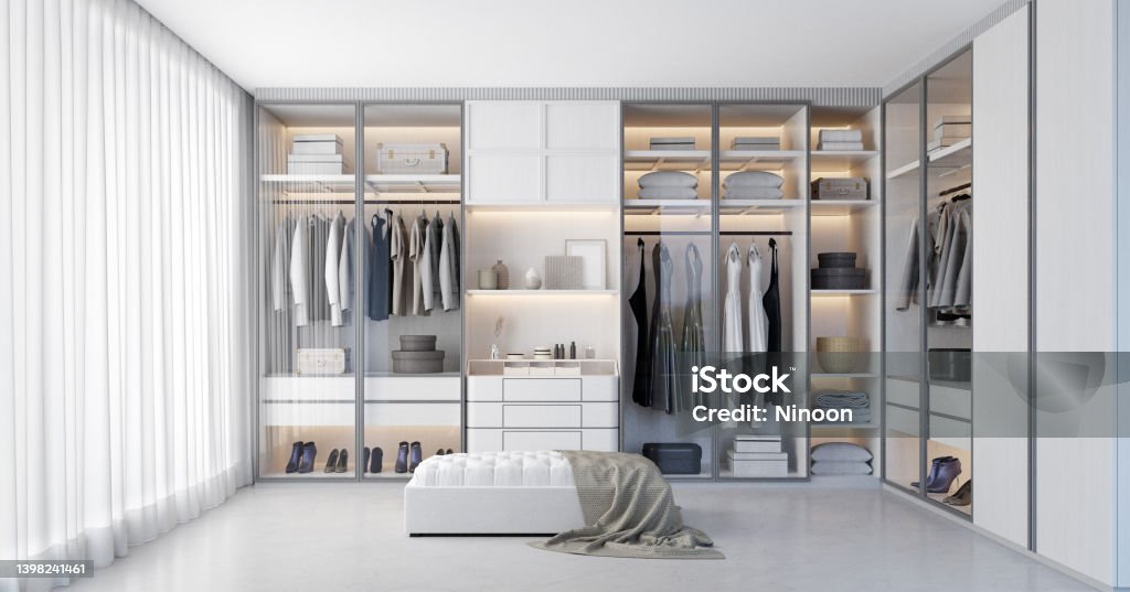White luxury walk in closet interior with light frome the window.3d rendering Walk-in Closet Stock Photo