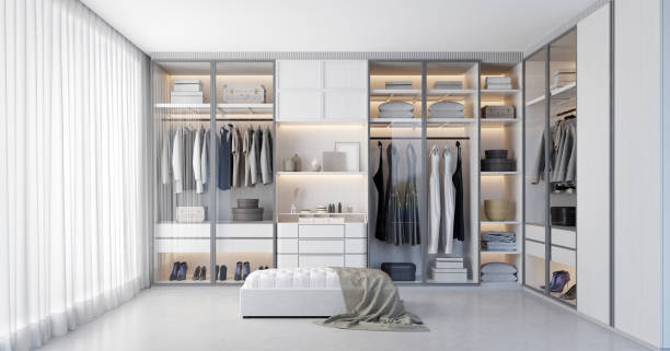 White luxury walk in closet interior with light frome the window.3d rendering stock photo