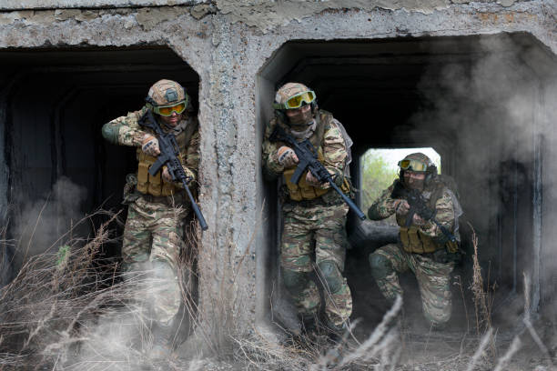 istock Three military mercenary soldiers during special operation. 1398241607