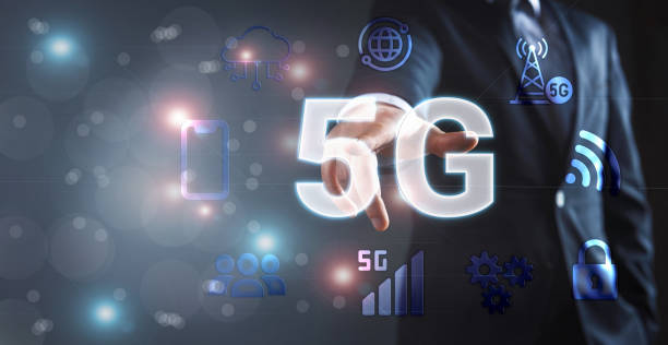 istock Businessman touches 5G on hologram screen 1398241694
