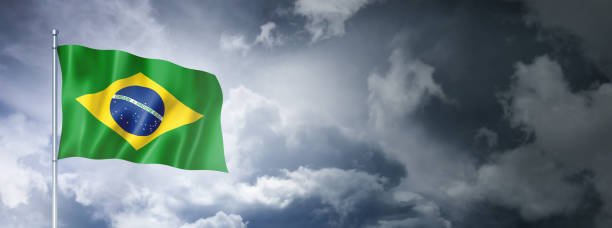 istock Brazilian flag on a cloudy sky 1398243291