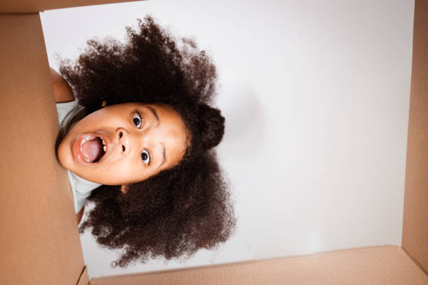 istock Surprised child unpack big gift box at home 1398245652
