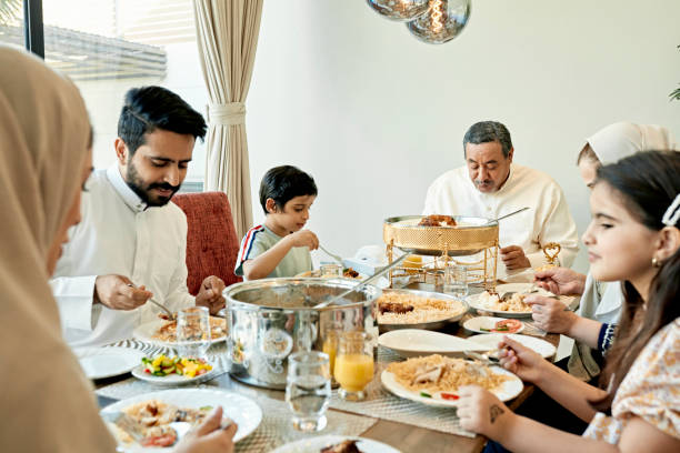 istock Multi-generation Saudi family enjoying traditional dishes 1398245710