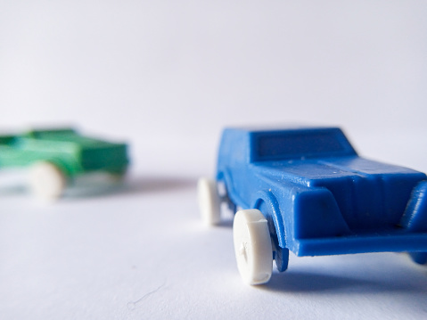 blue plastic toy car on a white background