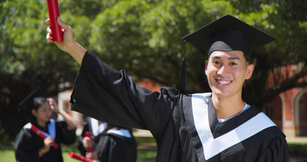 istock happy male graduate student 1398251720