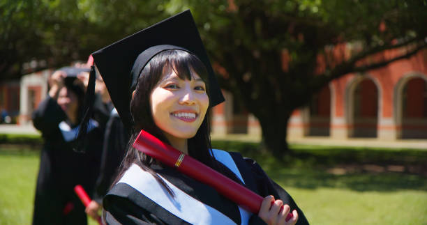 istock happy female graduate student 1398251797