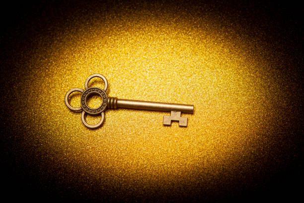 istock image of key gold background 1398251994