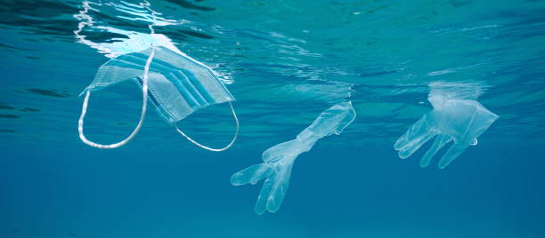 istock Ocean pollution Coronavirus waste plastic face mask and gloves 1398253835