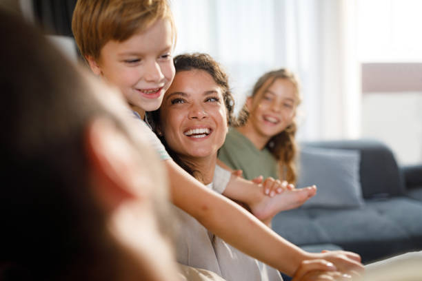 istock Happy family having fun while talking at home. 1398255251
