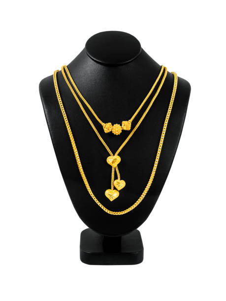 istock Gold necklace on necklace display stand isolated on white background, Save Clipping path. 1398258945