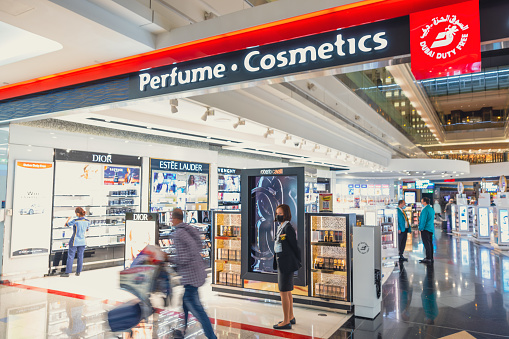 Transiting passengers doing last minute shopping at duty free shop at Dubai International Airport departure terminal