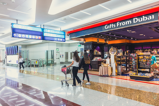 Passenger passing through Duty Free Shopping at Dubai International Departure Terminal.