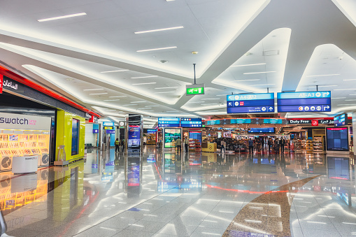 Dubai, UAE - April 27 2020: Wide image of Dubai International departure terminal. The airport terminal has all the required modern amenities such as restaurants, retail space, gaming arcades, prayer rooms, relaxation facilities such as spa, hotels. This multi-destination airport Terminal is one of the busiest airports in the world.
