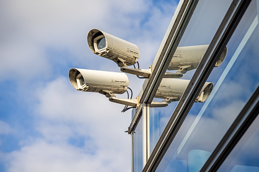 Surveillance cameras against the sky outside a shop on the Danish island Zealand
