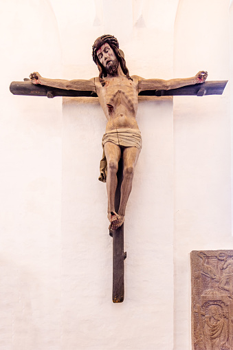Old crucifix on a wall in Ribe Domkirke, which is the oldest cathedral in Denmark. A great part of the building is from 1134 but it has been changed during the years. It is situated in Ribe town, which is the oldest town in Denmark and placed in the south western part of the peninsular Jutland