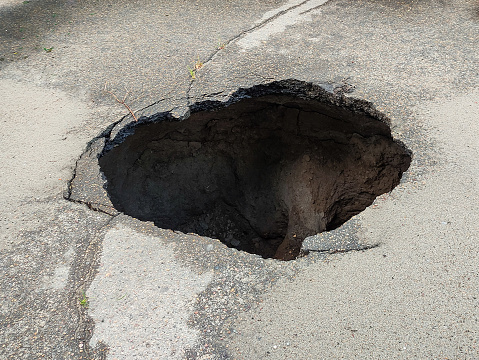 Large hole in the asphalt, sinkhole