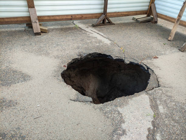 istock Large hole in the asphalt, sinkhole 1398261771