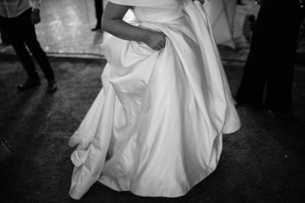 Sad bride lying dejectedly in a bathtub