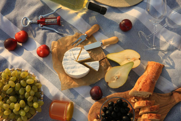 istock Different tasty snacks on picnic blanket, flat lay 1398266750