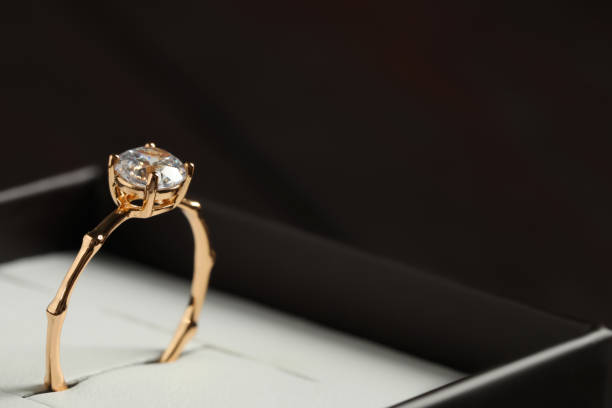 istock Beautiful engagement ring in box, closeup. Space for text 1398267009