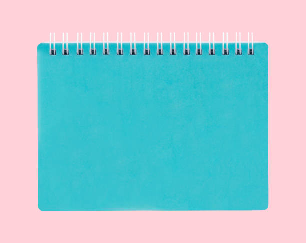 niebieski notatnik umieszczony na różowym tle. - note pad padding art sketch zdjęcia i obrazy z banku zdjęć