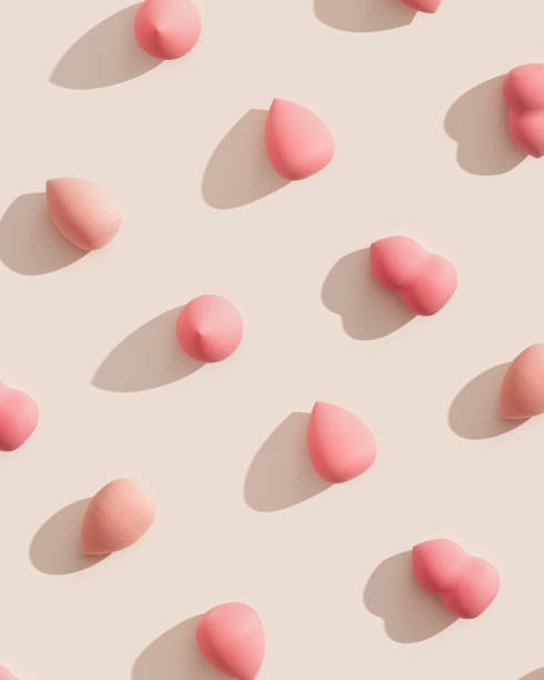 istock Geometric pattern from makeup sponges for foundation cream on beige background with dark shadows. Beauty blender pink and beige. Fashion Flat lay cosmetic sponge, top view graphic layout 1398267152