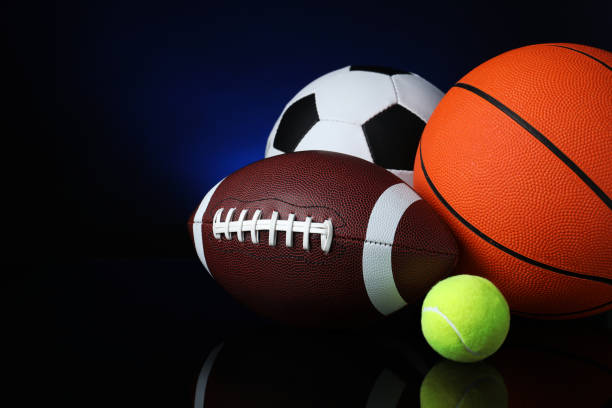 istock Set of different sport balls on black mirror surface 1398268625