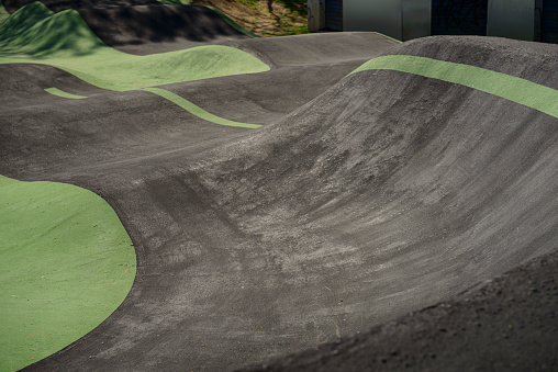 Part of a Pump Track circuit where you can see the slopes and curves.