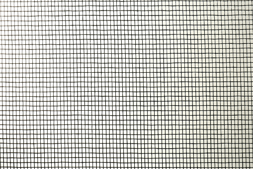 Closeup view of mosquito window screen on white background