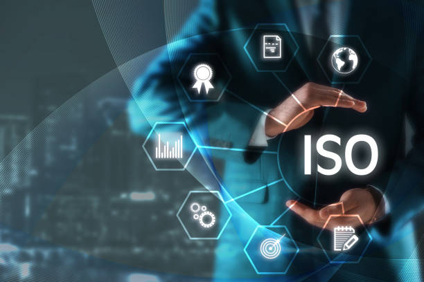 istock Man demonstrating at virtual icon with abbreviation ISO and different icons, closeup 1398269867