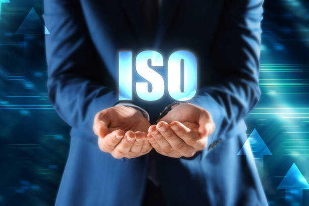 istock Man demonstrating virtual icon with abbreviation ISO, closeup 1398271123