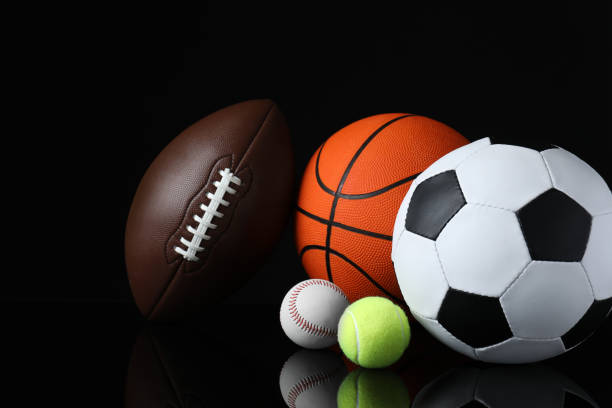 istock Set of different sport balls on black mirror surface 1398271966