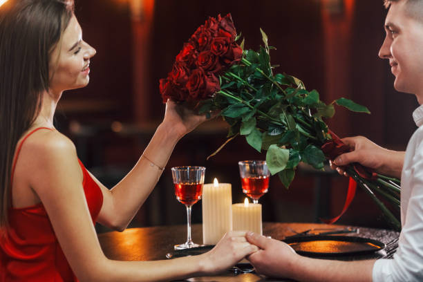 istock Sitting by the table. Romantic couple have dinner in the restaurant 1398276930