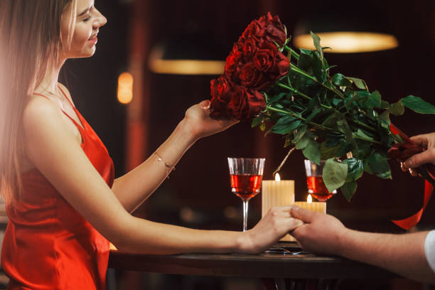 istock Sitting by the table. Romantic couple have dinner in the restaurant 1398276993