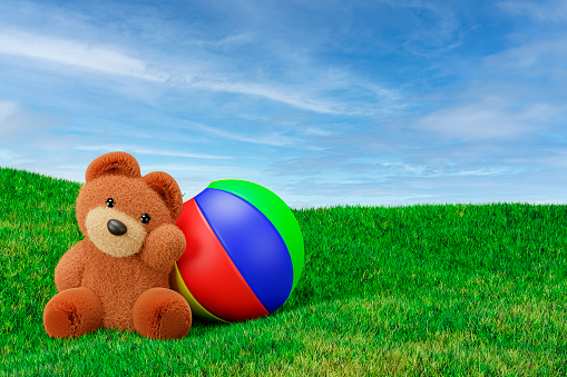 3d render illustration of stuffed toy bear playing ball on a grass meadow.