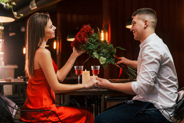Side view. Romantic couple have dinner in the restaurant
