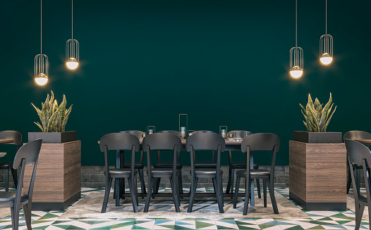 Retro restaurant with tables with drinks, decoration, lighting equipment, potted plants (sanseveria trifasciata) in large hardwood block pots on a petrol green plaster wall background. Multicolored tiled floor with a beige carpet under the tables. A vintage effect on a 3D rendered image.