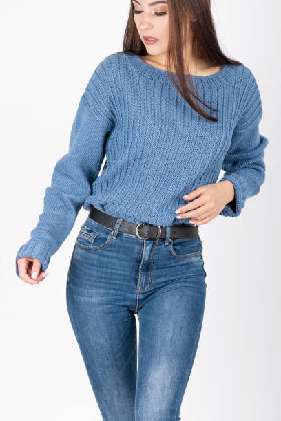 istock Woman with jeans and sweater studio portrait 1398280301