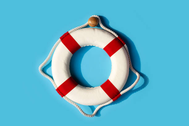 istock Lifebuoy on blue background. Copy space 1398282020