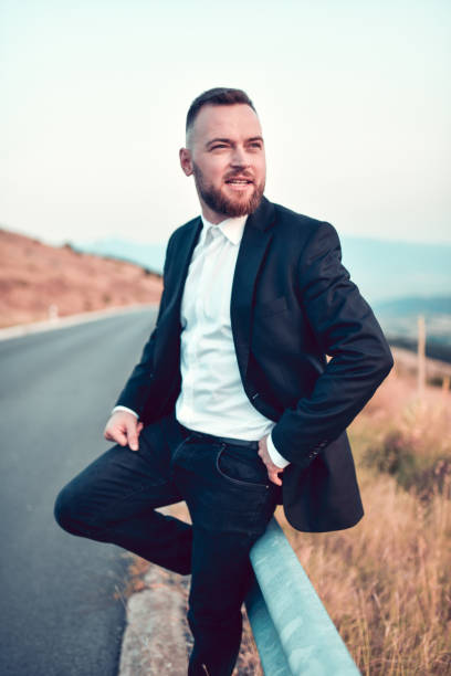 istock Best Man Waiting For Married Couple On Mountain Road 1398282395