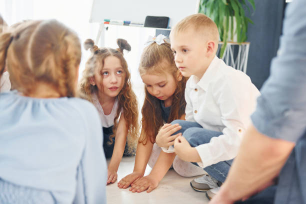 istock Group of children students in class at school with teacher 1398284947