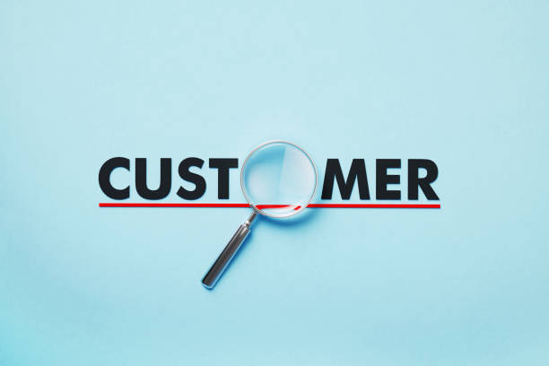 istock Magnifier Forming Customer Word On Blue Background 1398284953